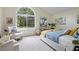 Bright bedroom with a large window, comfortable furniture, and neutral tones at 4345 Tucker North Dr, Tucker, GA 30084