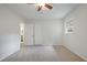 A bright bedroom with a ceiling fan, window, closet, and ensuite bathroom at 4345 Tucker North Dr, Tucker, GA 30084