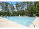 Large community swimming pool with ample seating and lifeguard stations for a relaxing and safe experience at 4345 Tucker North Dr, Tucker, GA 30084
