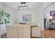 Bright dining area with hardwood floors, neutral walls, and a modern light fixture at 4345 Tucker North Dr, Tucker, GA 30084