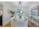 Elegant dining room with a modern chandelier, and views of greenery at 4345 Tucker North Dr, Tucker, GA 30084