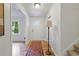 Inviting foyer with hardwood floors, a statement rug, and a decorative light fixture at 4345 Tucker North Dr, Tucker, GA 30084