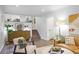 Open-concept living room with a modern design, hardwood floors, and a large window at 4345 Tucker North Dr, Tucker, GA 30084