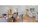Open floor plan living room with hardwood floors and natural light streaming through windows at 4345 Tucker North Dr, Tucker, GA 30084