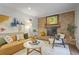 Spacious living room with a brick fireplace, modern decor, and lots of natural light at 4345 Tucker North Dr, Tucker, GA 30084