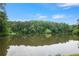 Beautiful view of the pond surrounded by a lush forest, offering a serene and natural setting at 4345 Tucker North Dr, Tucker, GA 30084