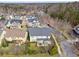 Aerial view showcasing the home's backyard patio, roof, and surrounding mature trees at 4492 Arbor Crest Ct, Suwanee, GA 30024