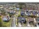 Aerial view of the community showcasing nearby tennis courts and well-maintained landscaping at 4492 Arbor Crest Ct, Suwanee, GA 30024