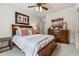 This bedroom features a ceiling fan, neutral carpeting, and elegant furnishings, creating a relaxing and comfortable atmosphere at 4492 Arbor Crest Ct, Suwanee, GA 30024