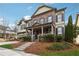 Beautiful two-story home with manicured lawn, featuring a covered porch and symmetrical facade at 4492 Arbor Crest Ct, Suwanee, GA 30024