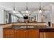 Open kitchen featuring a breakfast bar overlooking the living area at 4492 Arbor Crest Ct, Suwanee, GA 30024