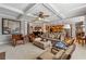 Elegant living room with coffered ceilings, recessed lighting, and an open layout to the kitchen at 4492 Arbor Crest Ct, Suwanee, GA 30024