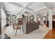 Bright living room with coffered ceilings, fireplace, built-in shelving, and plush seating arrangement at 4492 Arbor Crest Ct, Suwanee, GA 30024