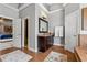 Well-appointed main bathroom with tile flooring, a large vanity, and a door leading to the bedroom at 4492 Arbor Crest Ct, Suwanee, GA 30024