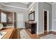 Well-lit main bathroom with neutral paint, tiled floors, glass shower, and tub at 4492 Arbor Crest Ct, Suwanee, GA 30024