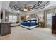 Spacious main bedroom with a tray ceiling, neutral carpet, and complementary furnishings at 4492 Arbor Crest Ct, Suwanee, GA 30024