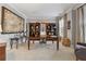 Bright office featuring a large desk, dual bookshelves, and neutral walls at 4492 Arbor Crest Ct, Suwanee, GA 30024