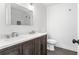 Bathroom with double sink vanity, quartz countertops, and walk-in shower at 462 Kendrick Se Ave, Atlanta, GA 30315