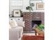 Close-up of a classic brick fireplace with decorative accents in a cozy living room at 462 Kendrick Se Ave, Atlanta, GA 30315
