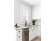 Bright kitchen featuring stainless steel appliances, white cabinetry, and modern backsplash at 462 Kendrick Se Ave, Atlanta, GA 30315