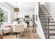Eat-in kitchen with white cabinets, stainless steel appliances, and hardwood floors at 462 Kendrick Se Ave, Atlanta, GA 30315