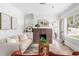 Bright living room featuring a fireplace, neutral decor, and hardwood floors at 462 Kendrick Se Ave, Atlanta, GA 30315