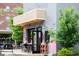 Exterior shot of a small business with a mural and outdoor seating at 462 Kendrick Se Ave, Atlanta, GA 30315