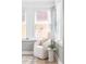 Bright sunroom with textured brick detail and a large, comfy chair at 462 Kendrick Se Ave, Atlanta, GA 30315