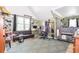 This cluttered bedroom features a bed, desk, a sofa, and carpet at 5028 Jamie Ne Ct, Woodstock, GA 30188
