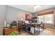This bedroom features a fan, window, desk, and carpet at 5028 Jamie Ne Ct, Woodstock, GA 30188