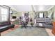 This cluttered bedroom features a bed, desk, a sofa, and carpet at 5028 Jamie Ne Ct, Woodstock, GA 30188