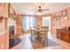 The dining room features hardwood floors, a fireplace, and an adjacent dining area with natural light at 5028 Jamie Ne Ct, Woodstock, GA 30188
