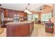 Eat-in kitchen features an island with granite countertops, updated appliances, and a cozy breakfast area at 5028 Jamie Ne Ct, Woodstock, GA 30188