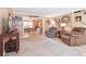 Cozy living room features a neutral color palette and flows into adjacent office at 5028 Jamie Ne Ct, Woodstock, GA 30188