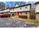 Street view of townhomes featuring brick facades and off-street parking at 1150 Rankin St # 6H, Stone Mountain, GA 30083