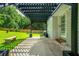 Back patio with bench seating and pergola at 120 Lakeside Dr, Ellenwood, GA 30294