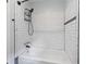 This shower/tub features subway tile and an adjustable shower head at 120 Lakeside Dr, Ellenwood, GA 30294