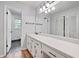 This spacious bathroom has plenty of counter space, storage, and updated lighting at 120 Lakeside Dr, Ellenwood, GA 30294