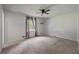 Neutral bedroom featuring carpet flooring, a ceiling fan, and ample natural light at 120 Lakeside Dr, Ellenwood, GA 30294