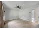This neutral bedroom has a ceiling fan, a double door closet and carpeted floor at 120 Lakeside Dr, Ellenwood, GA 30294