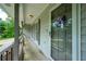 Cozy front porch with a storm door and decorative wreath, offering a warm welcome at 120 Lakeside Dr, Ellenwood, GA 30294