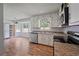 Functional kitchen features white cabinetry, stainless steel appliances, and laminate countertops at 120 Lakeside Dr, Ellenwood, GA 30294
