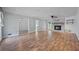 Spacious living room features wood floors, a brick fireplace, and ample natural light at 120 Lakeside Dr, Ellenwood, GA 30294