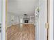 View from the front door into an open living room with a fireplace and wood floors at 120 Lakeside Dr, Ellenwood, GA 30294