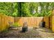 Backyard sitting area with chairs and a firepit at 4417 Village Square Ln, Stone Mountain, GA 30083