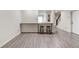 Finished basement featuring a bar area with granite countertop and modern flooring at 4417 Village Square Ln, Stone Mountain, GA 30083