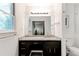 Bathroom features a granite vanity, modern sink, and an opening into another room with a barn door at 4417 Village Square Ln, Stone Mountain, GA 30083