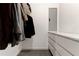 Walk-in closet featuring wood-look floors and storage with shelving and drawers at 4417 Village Square Ln, Stone Mountain, GA 30083