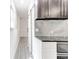 Modern kitchen with stainless steel microwave and a barn door to the hall at 4417 Village Square Ln, Stone Mountain, GA 30083