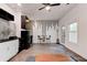 Modern kitchen with black appliances, sleek cabinets, and a cozy dining area at 4417 Village Square Ln, Stone Mountain, GA 30083